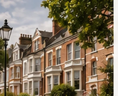 Row of Victorian and Edwardian terraced townhouses on a leafy Hampstead street.