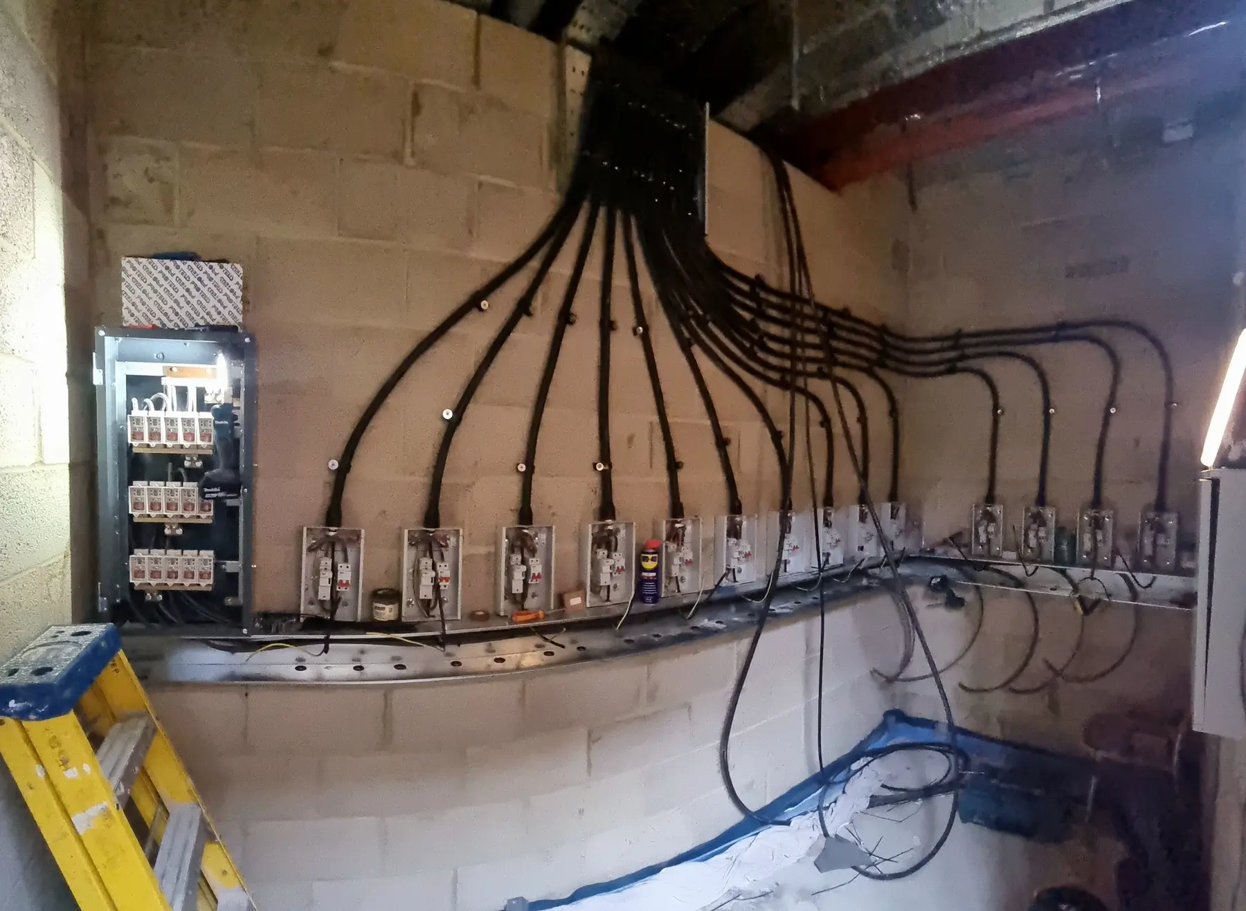 Fourteen individual electrical isolators and protected submains serving apartments in the Streatham development.