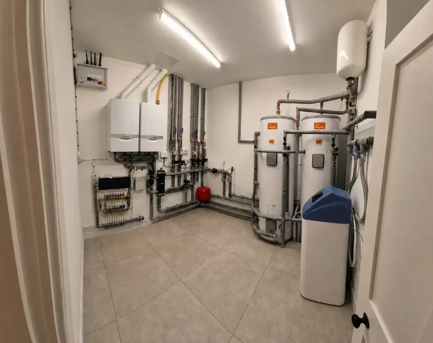 Actual PEP Notting Hill plant room installation with twin boilers and hot water cylinders